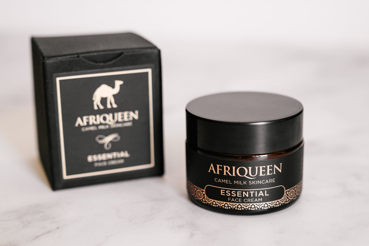 Afriqueen essential face cream jar and packaging on a white background