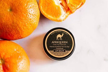 Lip balm container with oranges on a white background