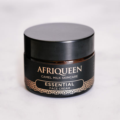 Black jar of Afriqueen Essential Face Cream on a white background